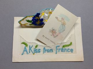 A Kiss From France WW1 silk postcard with opened envelope