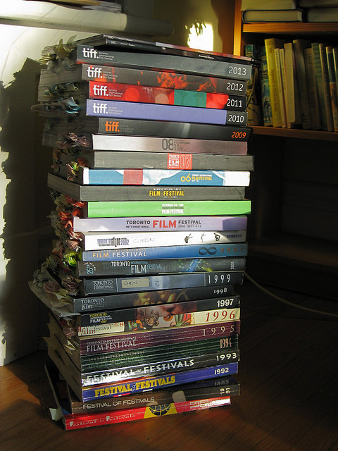 Pien's 24 years of TIFF programs with postit notes still on