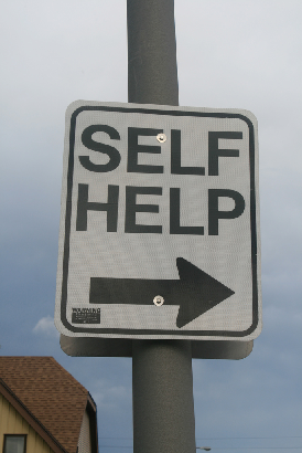 Self Help sign on a pole