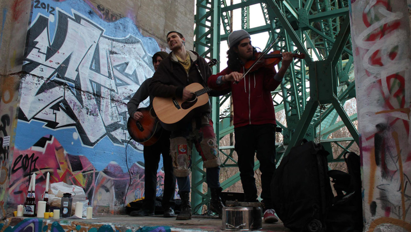 Lowdown Tracks DVD still photo showing performers under bridge