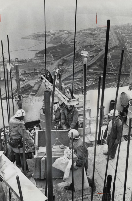 STEEL REINFORCING BARS and steel pipe-the backbone and arteries jut up from the rising CN Tower on the Metro waterfront Toronto Star January 2 1974 STEEL REINFORCING BARS and steel pipe-the backbone and arteries jut up from the rising CN Tower on the Metro waterfront Toronto Star January 2 1974