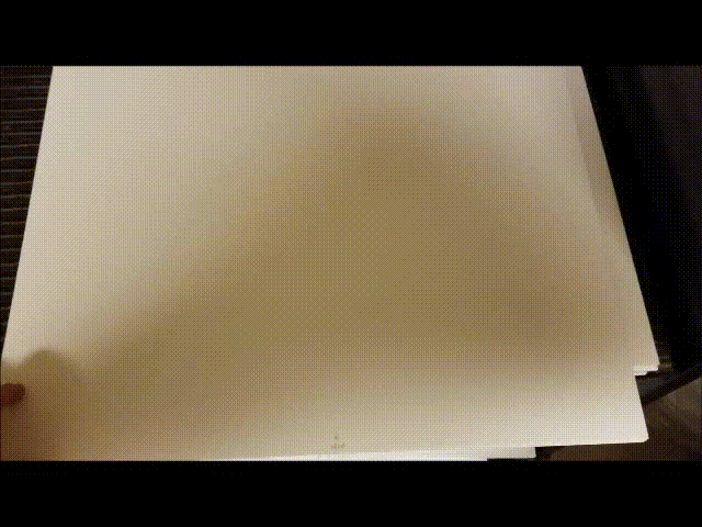 Movie showing the cover lifted to reveal a matte and then the matte lifted to reveal the entire artwork