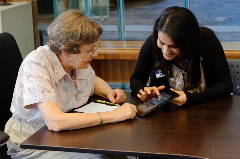 Senior learning to use an ipad2