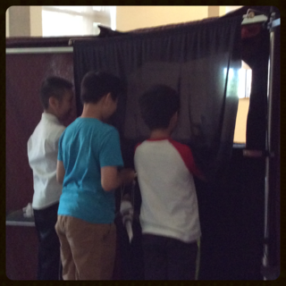 Kids putting on a Puppet Play