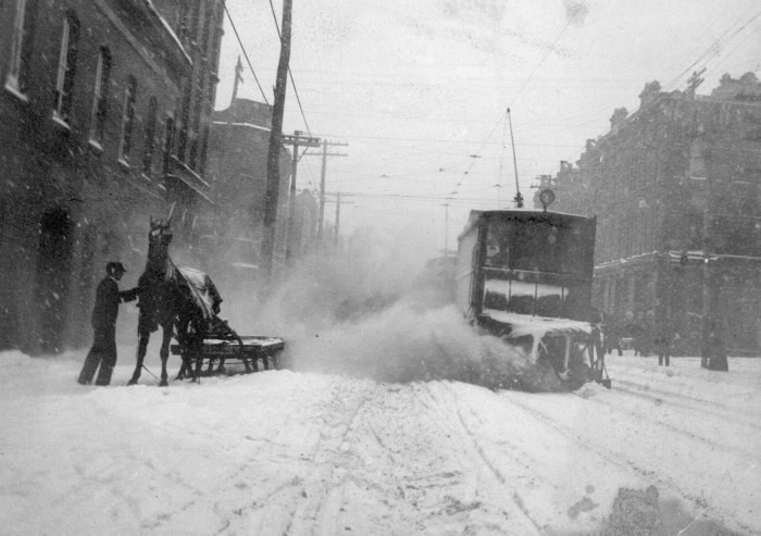 1900s circa Queen Street East between Church and Sherbourne showing sleigh and snow plow  electric tram