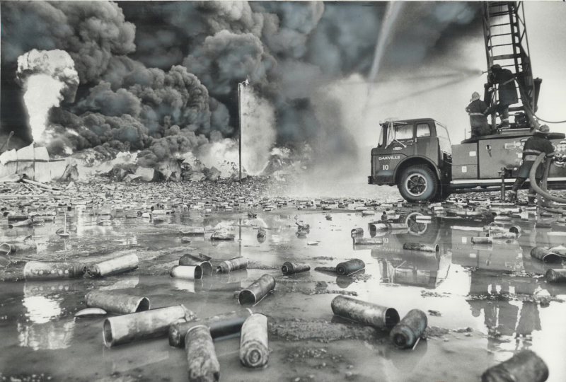 Fire truck spraying water on billowing smoke Fire truck spraying water on billowing smoke