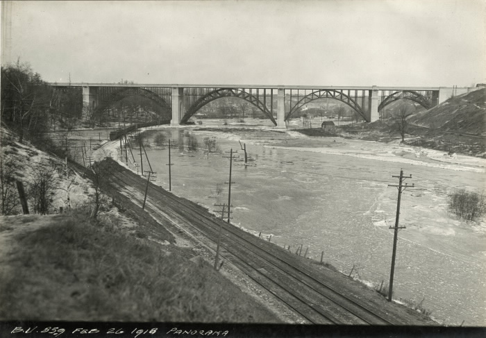 Railroad and icy river leading to profile of complete viaduct