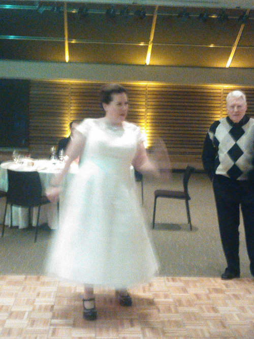 Traci looking really beautiful in her wedding dress and special shoes, getting funky on the dance floor. 