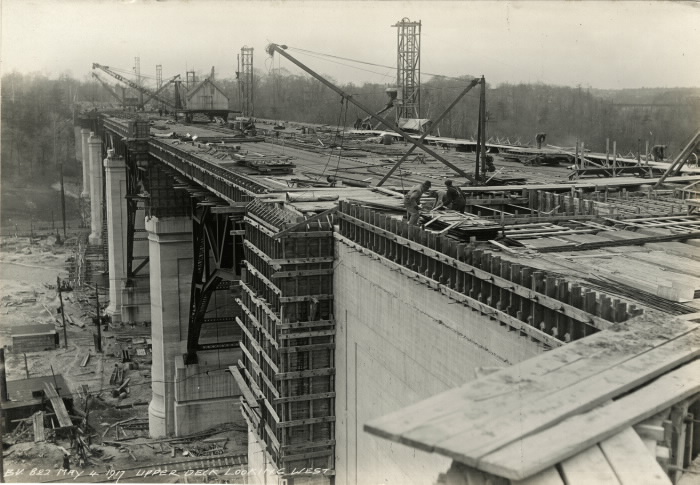An wide view of an almost completed bridge with workers