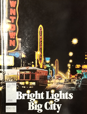 Book cover with library label and image of night lights
