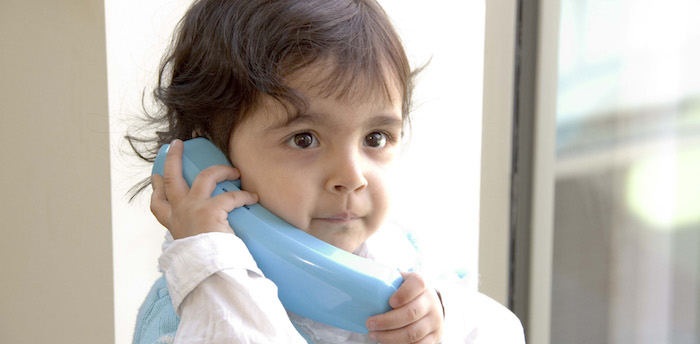 Child listening to telephone Child listening to telephone