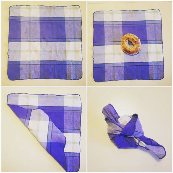 Wrapping a bagel in a cloth napkin Wrapping a bagel in a cloth napkin