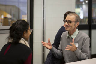 A member from Department of Imaginary Affairs talking to a program participant.