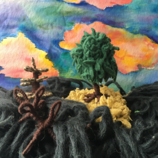 Colourful example of Kat Singer's textile art using watercolour paint and yarn.