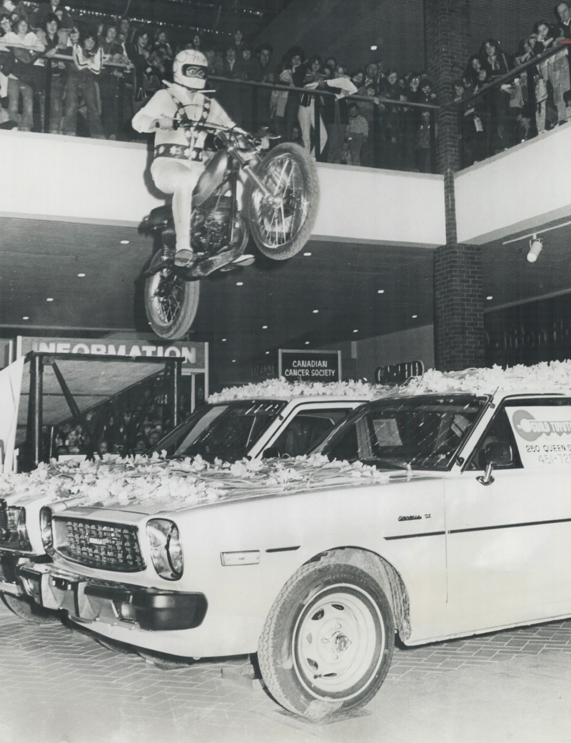Paul Thruston in 1977 leaped over 2 daffodil-covered cars for the Canadian Cancer Society