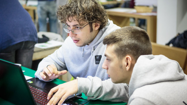 Two young men with a laptop