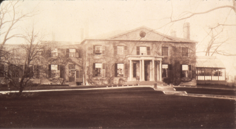 Vintage photo of large manor with large front yard
