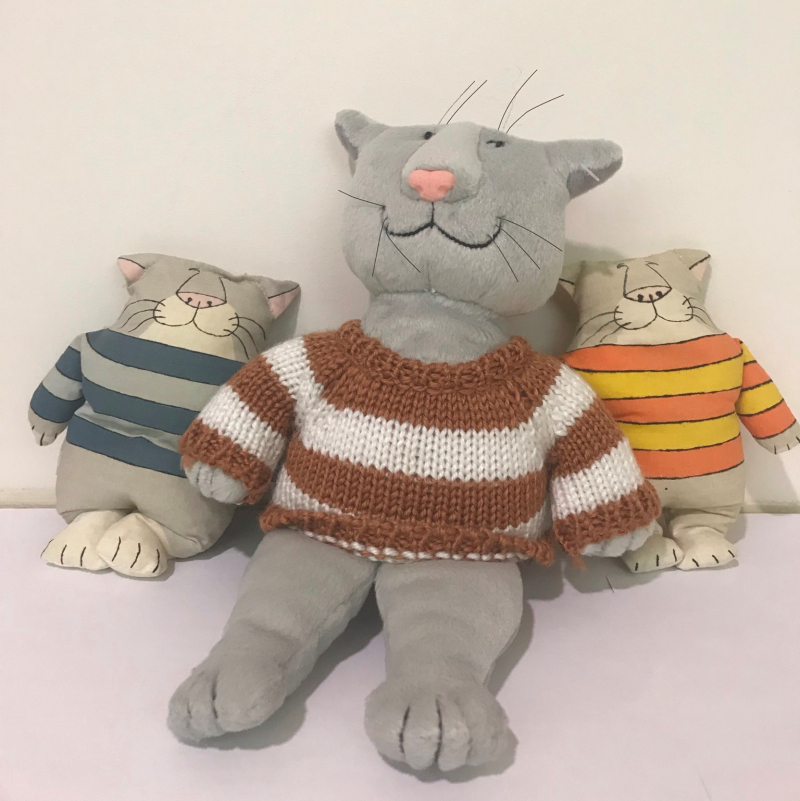 Three stuffed cats designed by Edward Gorey