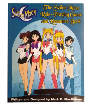 Book cover with Sailor Moon at centre, surrounded by four other characters from the manga series.