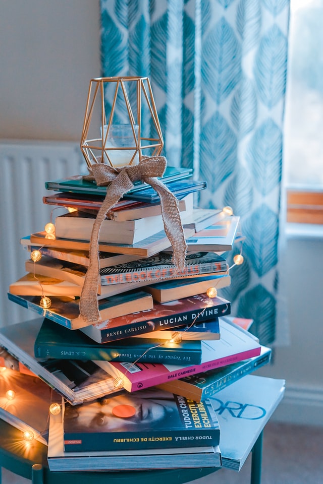 Wire tree atop a stack of books Wire tree atop a stack of books