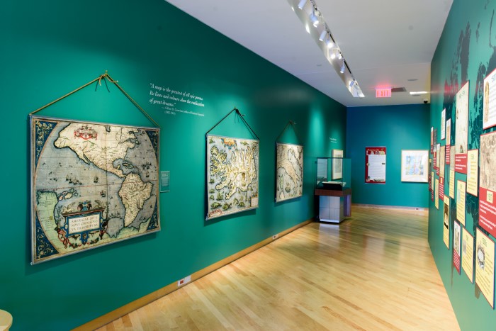 Interior of gallery with old maps on walls