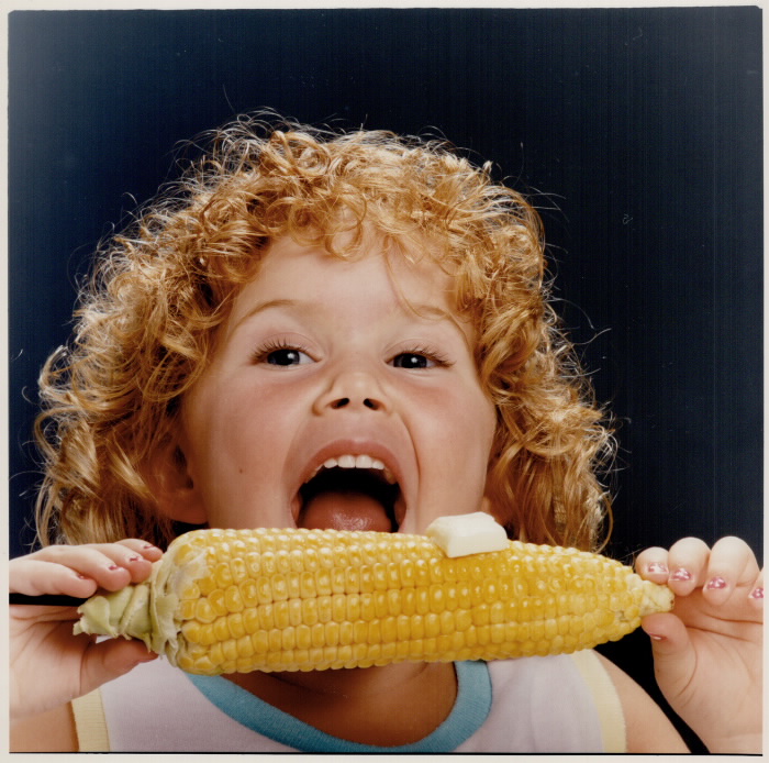 Child eating corn on the cob