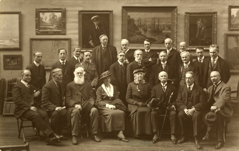 Vintage group portrait in an art gallery mostly of men