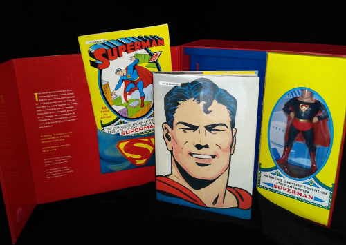 Superman: Masterpiece Edition set open to show cover with full-page illustration and collectible figurine