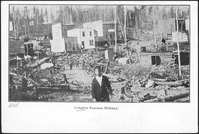 Inset photo of cluster of wood buildings and planks between them with young man looking at camera