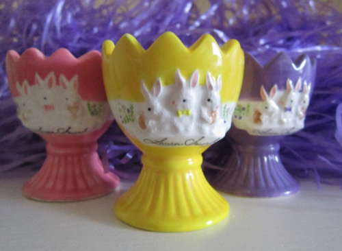 Pastel coloured egg holders with white bunnies and Laura Secord autograph