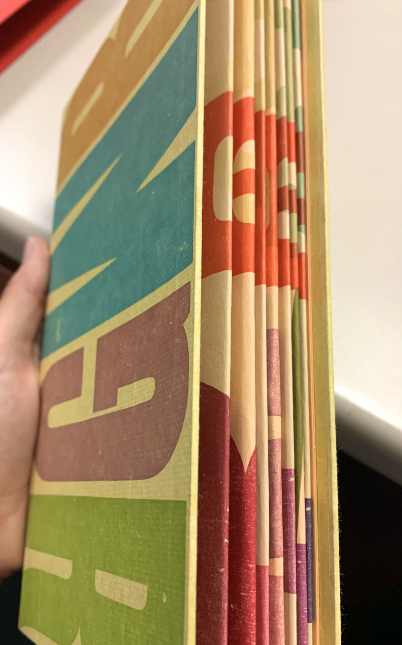 Book covered in colourful printed letters