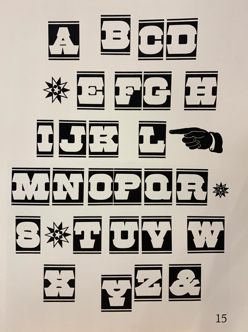 Wood type specimen of a sans serif upper case alphabet with a star and manicule ornament