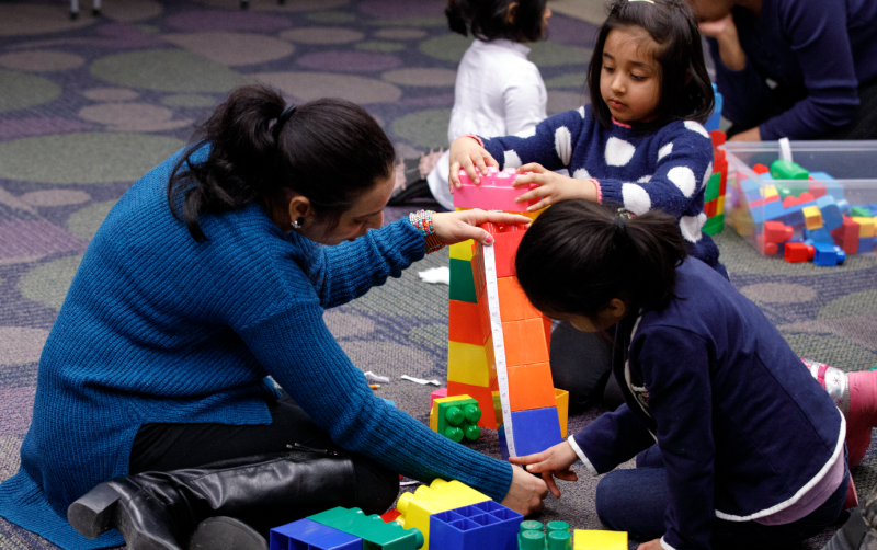 Family building Lego tower together