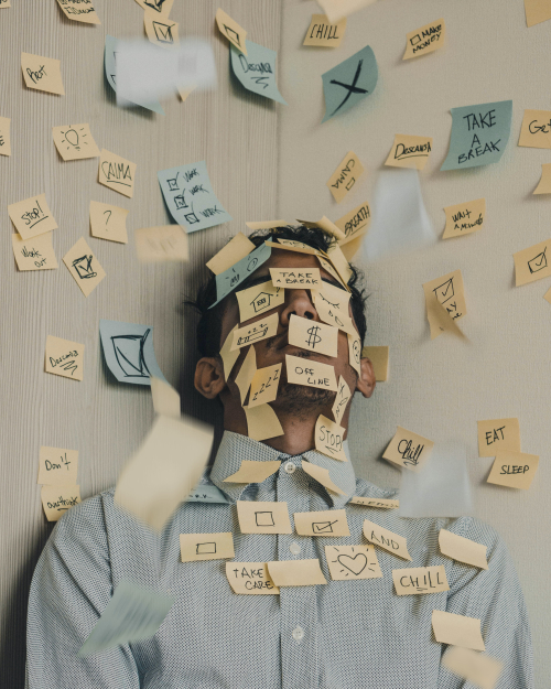From Unsplash by luis-villasmil man covered in sticky notes