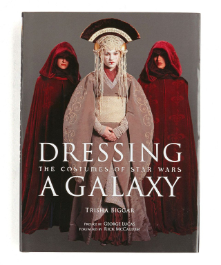 Book cover with photograph of Queen Padmé Amidala in gown and headress with two cloaked figures
