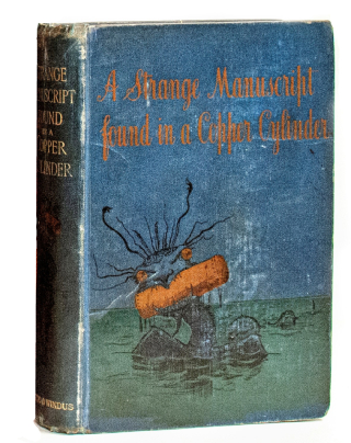 A closed cloth-covered book features a cartoonish sea monster emerging from water, holding a copper-coloured cylinder in its mouth.