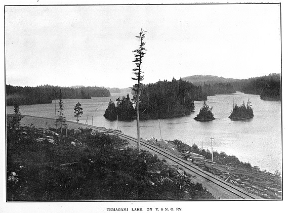 Temagami lake with rail line near it and subtitle Temagami Lake, On, T & N O, RY