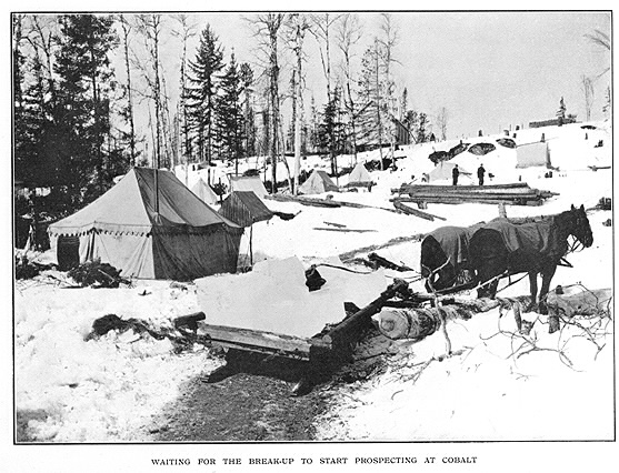 Winter scene of mining camp with horse sled