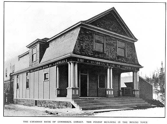 Building with barn shaped roof reading the Canadian Bank of Commerce with subtitle The Canadian Bank of Commerce Cobalt The Finest Building the The Mining Town