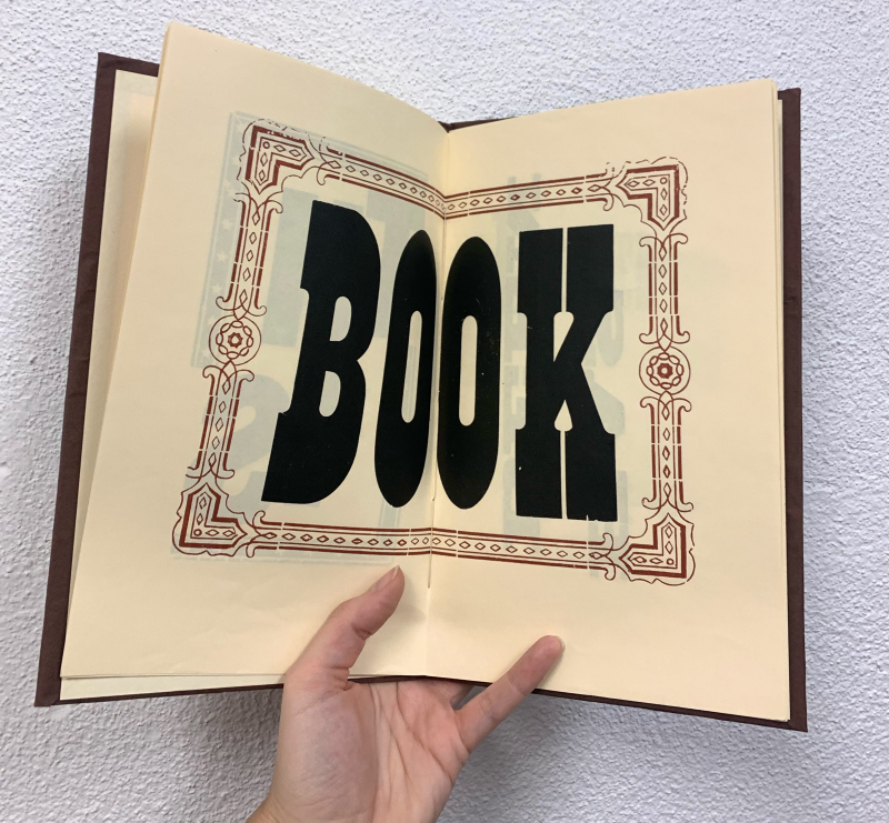 Inner page of "This Book" by Brandstead Press displaying large format type