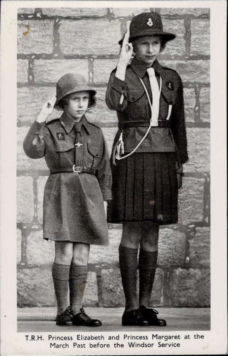 Framed photo of two saluting girls in uniforms and caption reading T R H Princess Elizabeth and Princess Margaret at the March Past before the Windsor Service