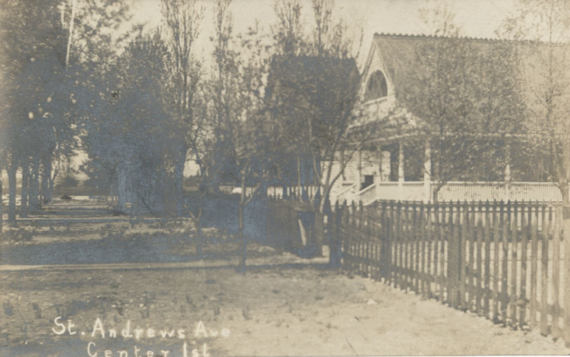 Vintage postcard with a road and a house behind trees and the words St. Andrews Ave Center Isl