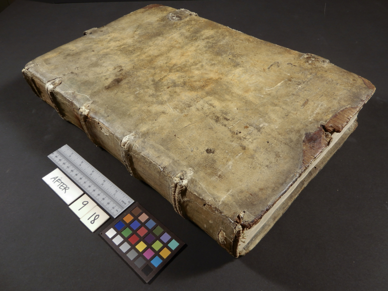 Old book with blank cover next to measurement tools and the text After and a date
