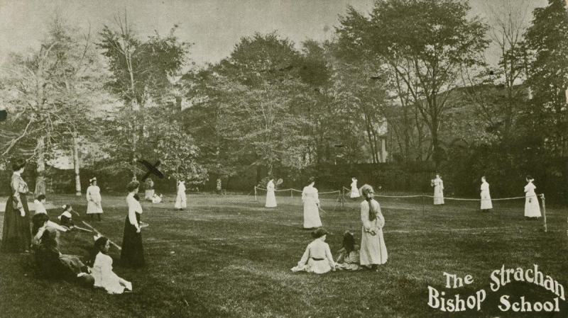 Postcard of girls playing lawn sports with wavy text reading The Bishop Stachan school