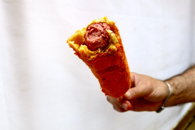 Cheeto corn dog with a bite missing