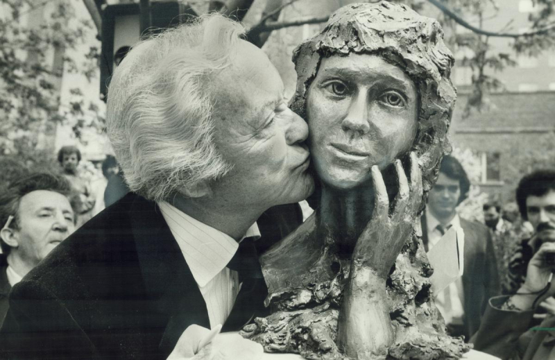 Old man kissing statue of Mary Pickford