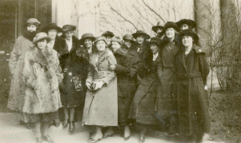 Large group of women posing in coats in old photo