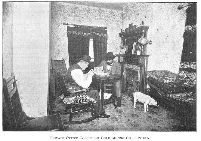 Vintage office interior with two men and dog at table office
