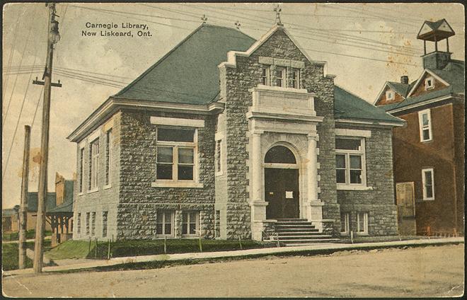 Vintage postcard of stone building with large doors and entrance 