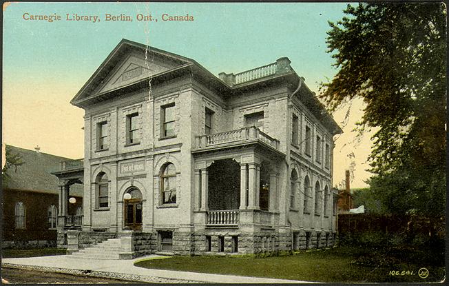Vintage postcard of two storey stone building with balconies